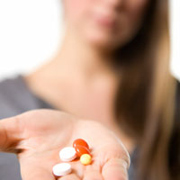 teens holding pills