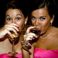 two bridesmaids drinking alcohol