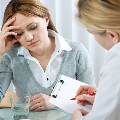therapist evaluating the level of stress of a patient