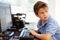 teenage boy on a computer