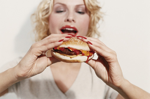 sexy woman holding a burger