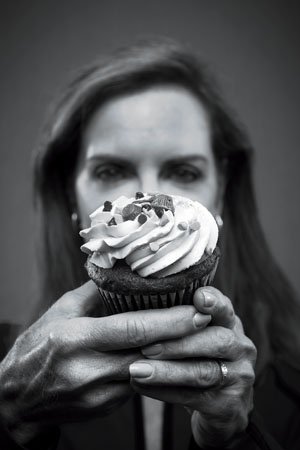 Dr. Pamela Peeke holding a cupcake