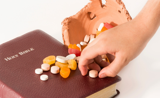 pills on a bible