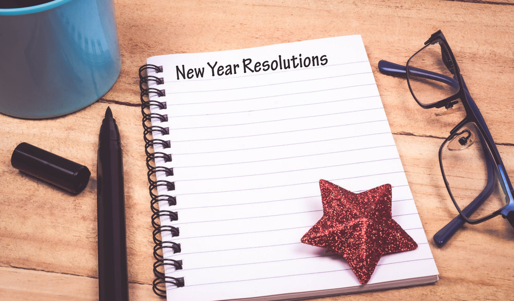 Paper that says new year resolutions and star