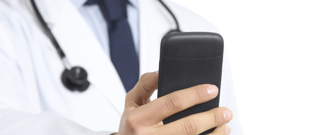 Doctor man hand using smart phone
