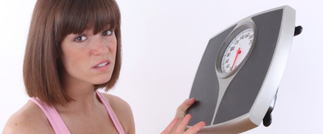girl unhappy with her scale