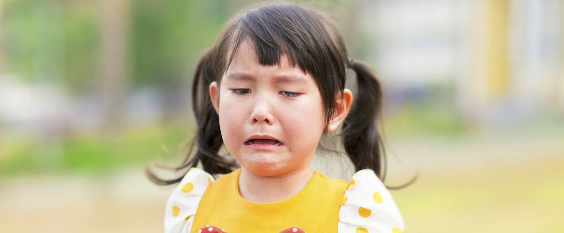 crying little girl in the park