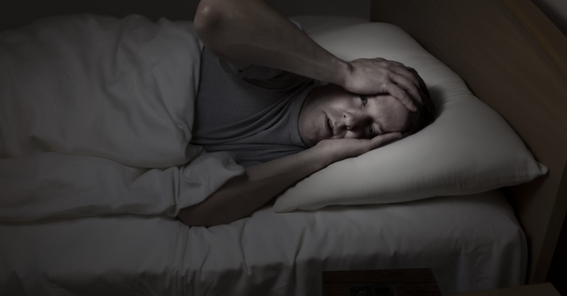 man suffering from sleep problems because bipolar disorder