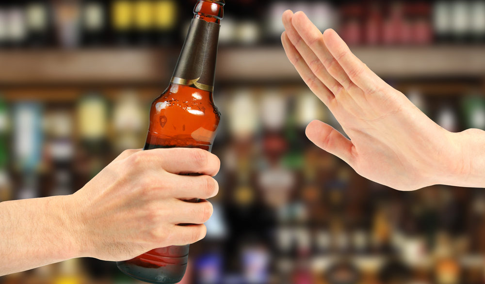 hands saying no to beer